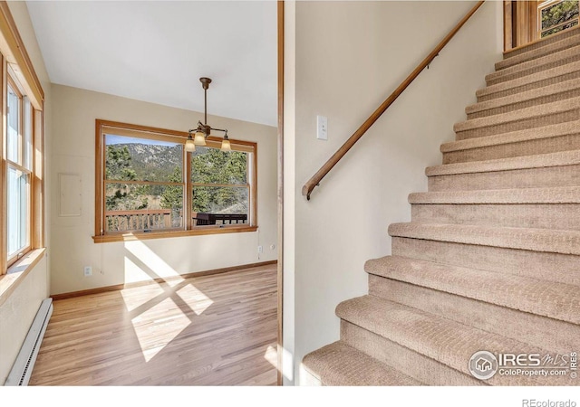 15 Golden Age Rd, Jamestown, CO 80455 - stairway with baseboard heating and wood finished floors