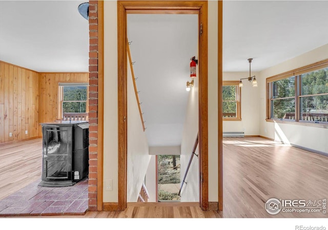 15 Golden Age Rd, Jamestown, CO 80455 - detailed view of a baseboard radiator, wood finished floors, and wooden walls