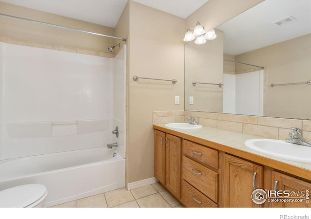 full bath with a sink, visible vents, washtub / shower combination, and tile patterned floors