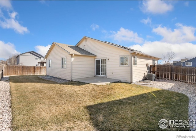 back of house with cooling unit, a yard, a patio, and a fenced backyard