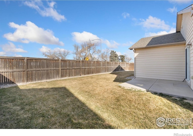 view of yard featuring a fenced backyard and a patio area