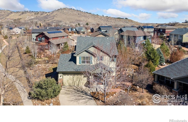 bird's eye view with a residential view and a mountain view