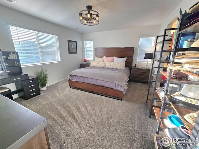 bedroom with visible vents, carpet, and baseboards