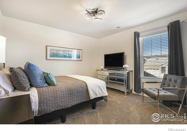 bedroom featuring carpet flooring and visible vents