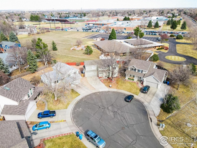 birds eye view of property with a residential view