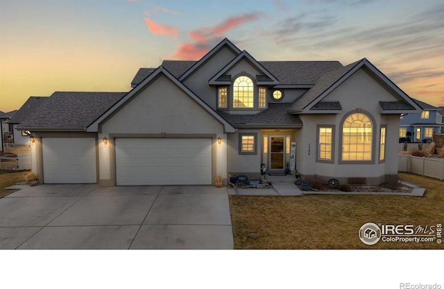 1386 Plains Ct, Eaton, CO 80615 - traditional home featuring stucco siding, concrete driveway, a garage, and roof with shingles