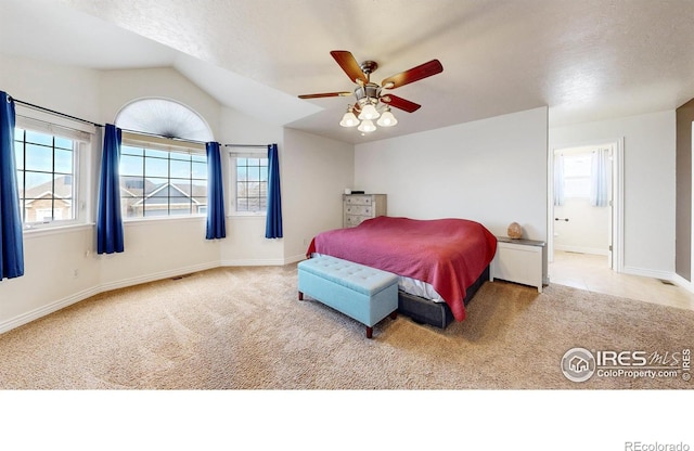 1386 Plains Ct, Eaton, CO 80615 - bedroom featuring carpet, baseboards, ensuite bath, ceiling fan, and vaulted ceiling