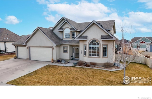 1386 Plains Ct, Eaton, CO 80615 - traditional-style home featuring concrete driveway, a front yard, roof with shingles, stucco siding, and a garage