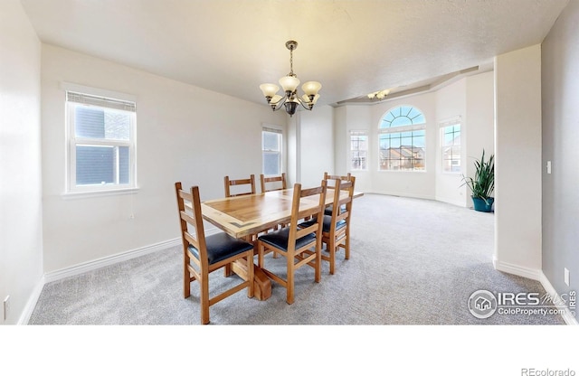 1386 Plains Ct, Eaton, CO 80615 - carpeted dining area featuring a notable chandelier, a healthy amount of sunlight, and baseboards