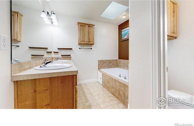 1386 Plains Ct, Eaton, CO 80615 - full bathroom with toilet, a skylight, tile patterned flooring, a bath, and vanity