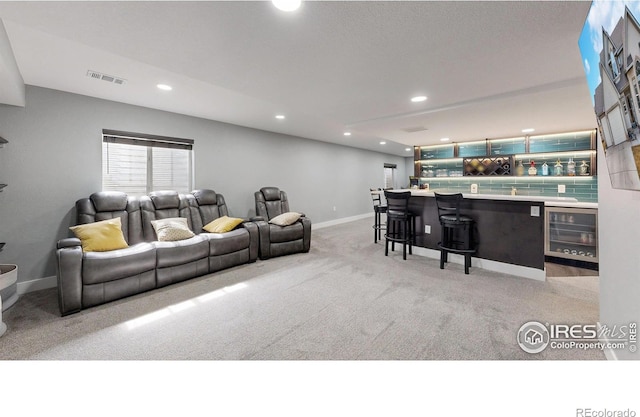 1386 Plains Ct, Eaton, CO 80615 - carpeted living area with visible vents, baseboards, wine cooler, a dry bar, and recessed lighting