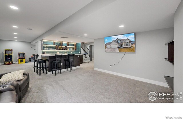1386 Plains Ct, Eaton, CO 80615 - interior space with visible vents, baseboards, recessed lighting, a bar, and light colored carpet