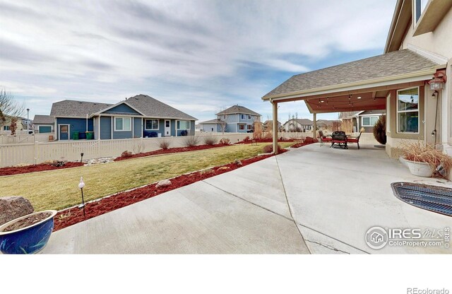 1386 Plains Ct, Eaton, CO 80615 - view of patio with a residential view and fence