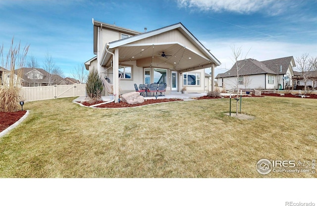 1386 Plains Ct, Eaton, CO 80615 - back of house featuring fence, stucco siding, a yard, a ceiling fan, and a patio