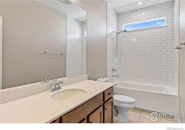 bathroom with tile patterned floors, visible vents, toilet, vanity, and shower / bathtub combination