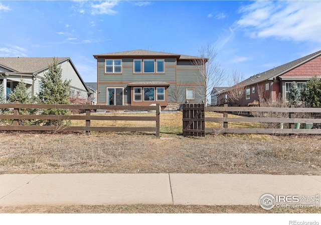 view of front of house with fence private yard