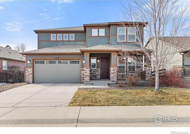 prairie-style house featuring a garage, a front lawn, covered porch, and driveway