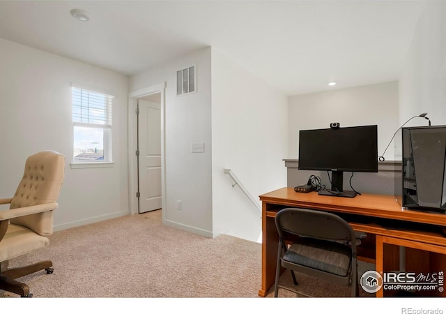 home office featuring carpet, visible vents, and baseboards