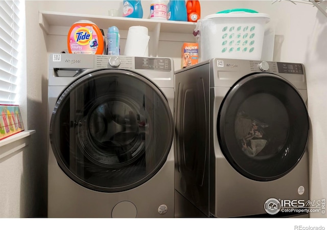 laundry room with independent washer and dryer and laundry area