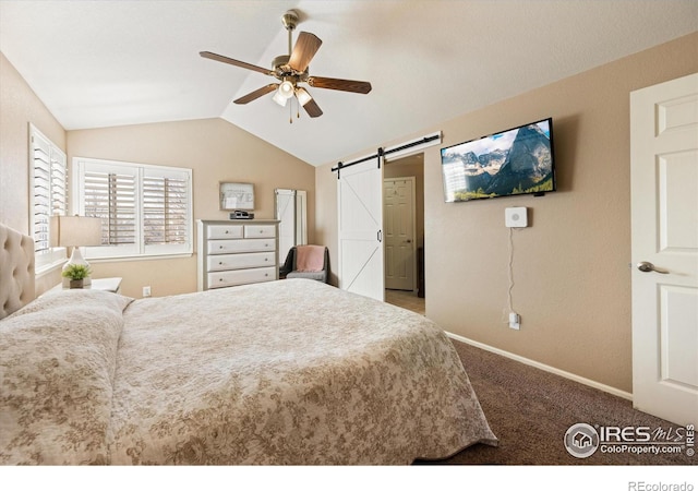 bedroom featuring ceiling fan, baseboards, carpet, a barn door, and vaulted ceiling