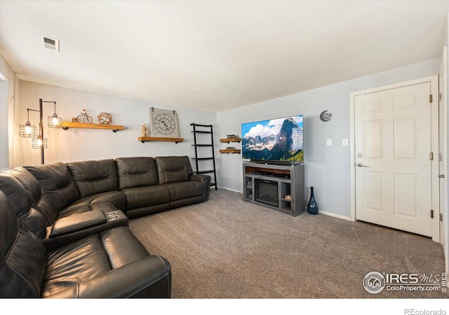 living room featuring carpet flooring, baseboards, and visible vents