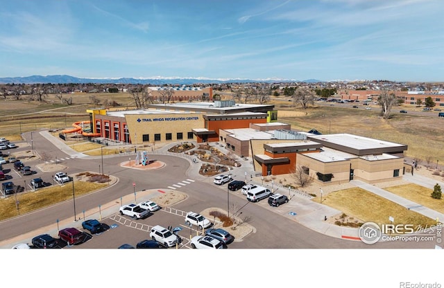 birds eye view of property featuring a mountain view