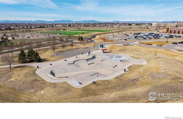 birds eye view of property featuring a mountain view