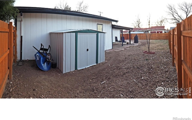 view of shed featuring a fenced backyard