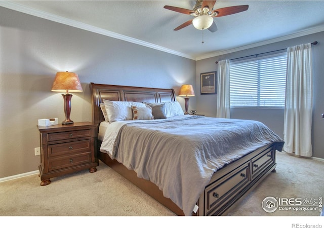 bedroom with light carpet, crown molding, and baseboards