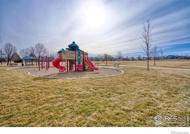 communal playground featuring a lawn