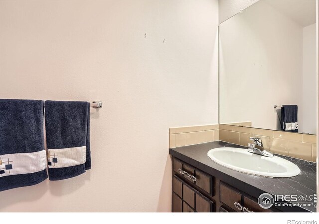 325 Fox Ct, Boulder, CO 80303 - bathroom with vanity and decorative backsplash