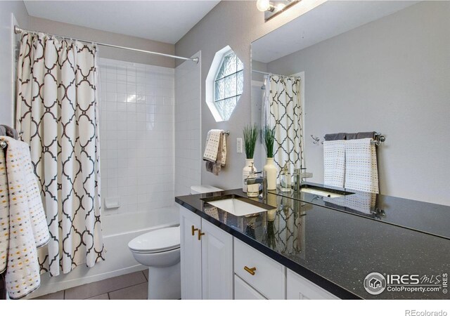 2073 River W Dr, Windsor, CO 80550 - full bathroom featuring vanity, toilet, tile patterned flooring, and shower / tub combo with curtain