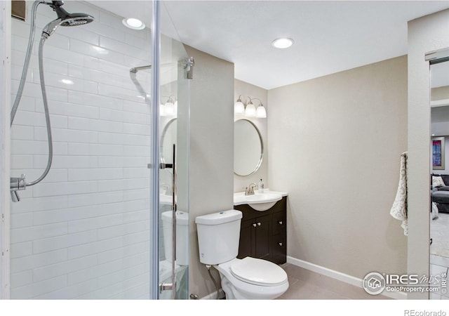 2073 River W Dr, Windsor, CO 80550 - bathroom with baseboards, vanity, a shower stall, and toilet