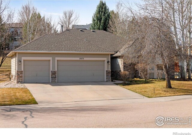 2073 River W Dr, Windsor, CO 80550 - view of front of property with stone siding, concrete driveway, roof with shingles, and a garage