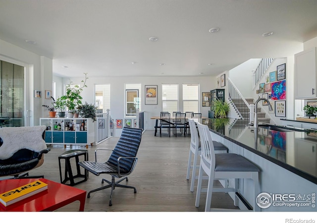 interior space featuring light wood-style floors and stairs