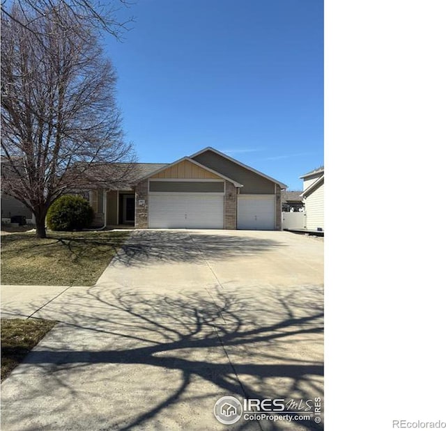 view of front of property featuring an attached garage, brick siding, and driveway