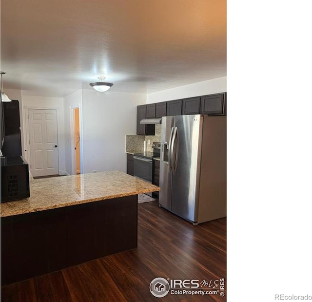 kitchen with electric range, light stone counters, dark wood finished floors, a peninsula, and stainless steel fridge with ice dispenser