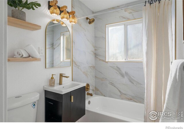 bathroom with vanity, shower / bath combination with curtain, and toilet