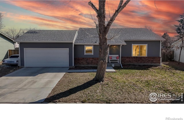 ranch-style house with driveway, brick siding, an attached garage, and a shingled roof