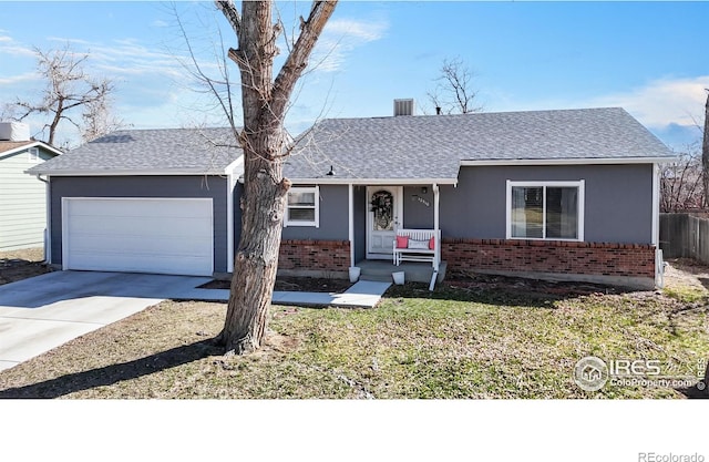 single story home with brick siding, an attached garage, concrete driveway, and roof with shingles