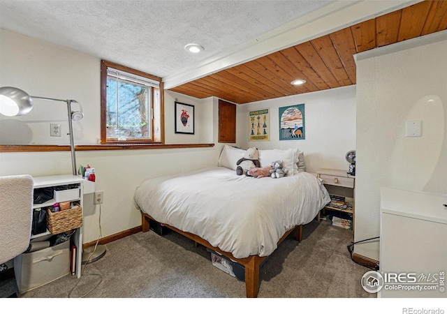 carpeted bedroom with wooden ceiling, recessed lighting, baseboards, and a textured ceiling