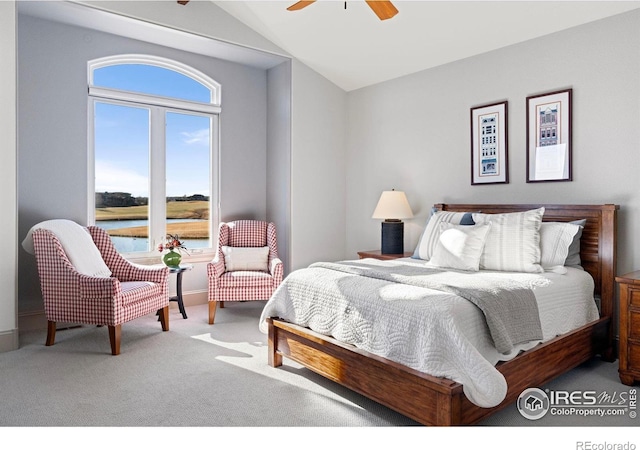 bedroom with carpet, a ceiling fan, and vaulted ceiling