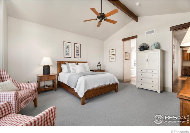 bedroom featuring carpet, visible vents, high vaulted ceiling, ensuite bath, and beam ceiling