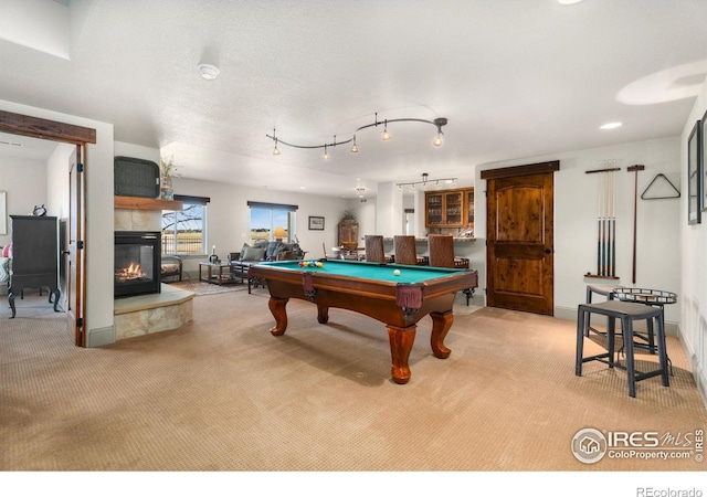 rec room featuring a multi sided fireplace, recessed lighting, billiards, and carpet