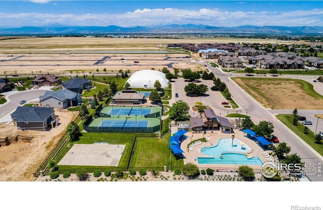 drone / aerial view with a residential view and a mountain view