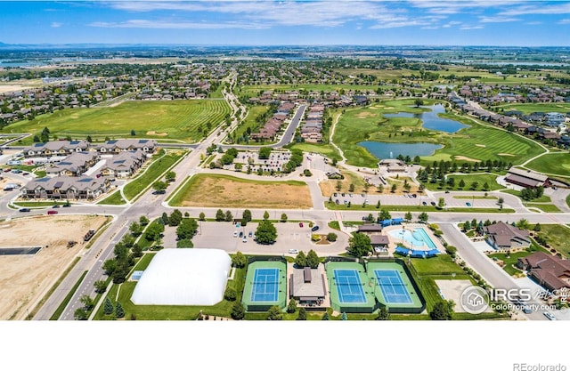 bird's eye view featuring a residential view, a water view, and view of golf course