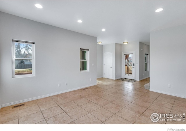 229 3rd St, Fort Collins, CO 80524 - unfurnished room with light tile patterned floors, baseboards, plenty of natural light, and recessed lighting