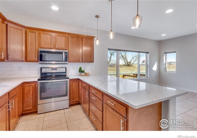 229 3rd St, Fort Collins, CO 80524 - kitchen featuring appliances with stainless steel finishes, healthy amount of natural light, a peninsula, backsplash, and recessed lighting