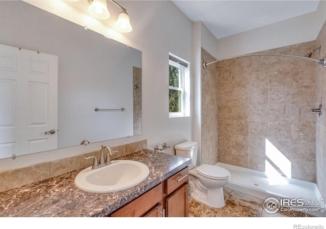 229 3rd St, Fort Collins, CO 80524 - full bathroom with a tile shower, toilet, and vanity
