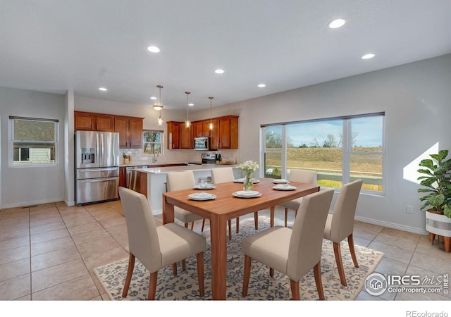 229 3rd St, Fort Collins, CO 80524 - dining room featuring healthy amount of natural light, light tile patterned floors, recessed lighting, and baseboards